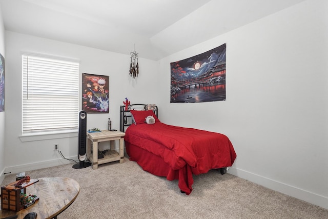 carpeted bedroom featuring multiple windows, lofted ceiling, and baseboards