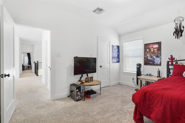 carpeted bedroom featuring visible vents, baseboards, and vaulted ceiling