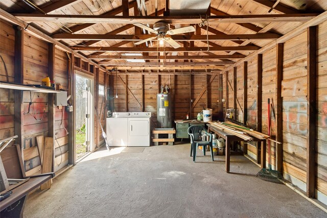 interior space with washer and dryer, water heater, and ceiling fan