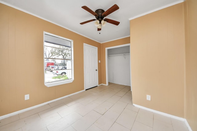 unfurnished bedroom with a closet, baseboards, ceiling fan, and crown molding