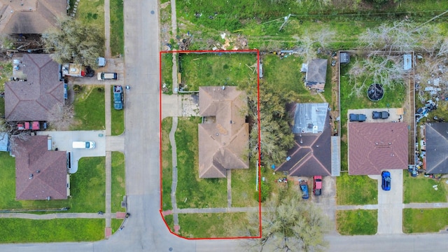 birds eye view of property with a residential view