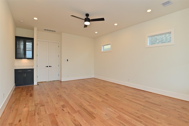 empty room featuring recessed lighting, visible vents, baseboards, and light wood-style flooring