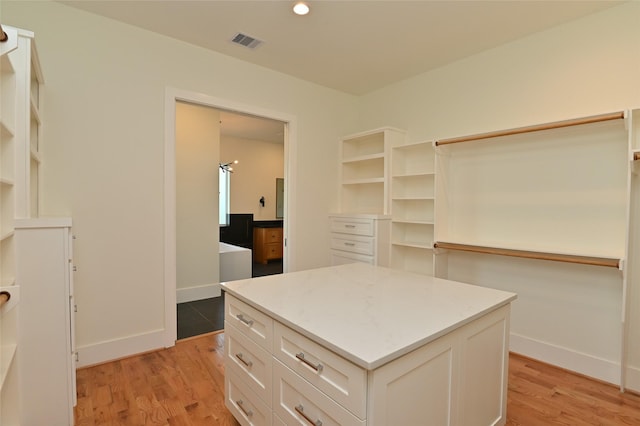 walk in closet featuring visible vents and light wood finished floors