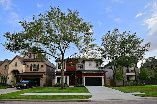 view of front of property with a standing seam roof, metal roof, concrete driveway, a front yard, and a garage