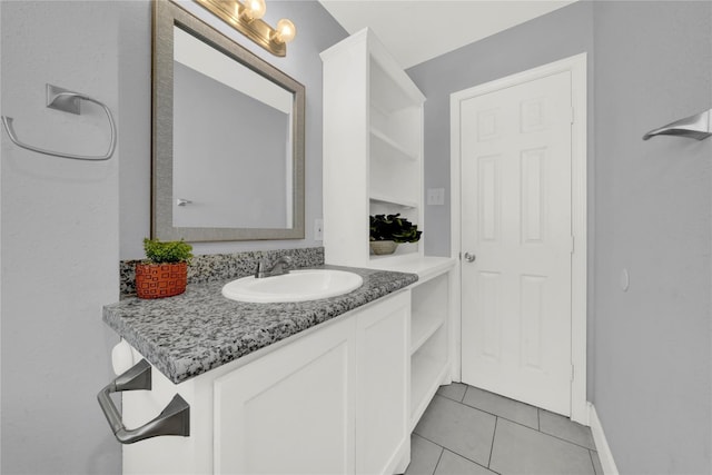 bathroom featuring tile patterned flooring and vanity