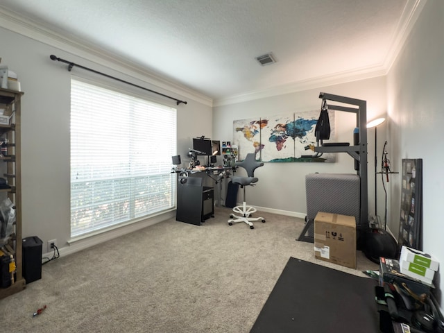 carpeted home office featuring baseboards, visible vents, and ornamental molding