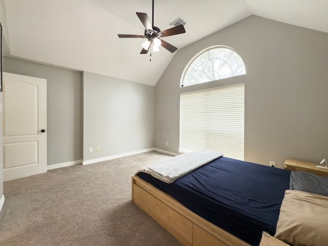 carpeted bedroom featuring visible vents, lofted ceiling, baseboards, and ceiling fan