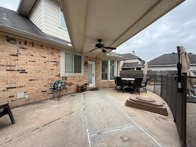 view of patio / terrace featuring outdoor dining space, a ceiling fan, and fence