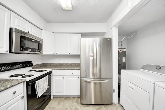 10555 Turtlewood Ct Unit 1510, Houston, TX 77072 - kitchen featuring electric water heater, separate washer and dryer, a textured ceiling, white cabinets, and appliances with stainless steel finishes