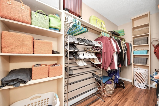 10555 Turtlewood Ct Unit 1510, Houston, TX 77072 - walk in closet featuring wood finished floors