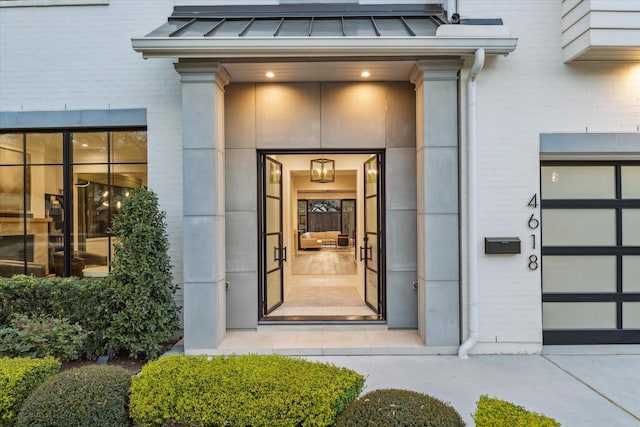 property entrance featuring a standing seam roof, brick siding, and metal roof