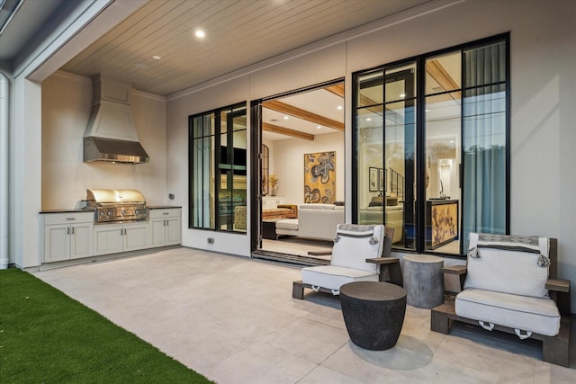 view of patio with grilling area and an outdoor kitchen