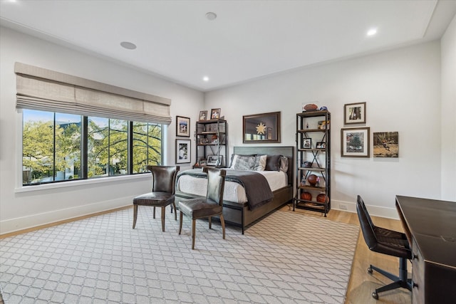 bedroom with recessed lighting, light wood-type flooring, and baseboards