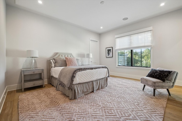 bedroom featuring recessed lighting, baseboards, and wood finished floors