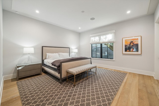 bedroom featuring recessed lighting, baseboards, and wood finished floors