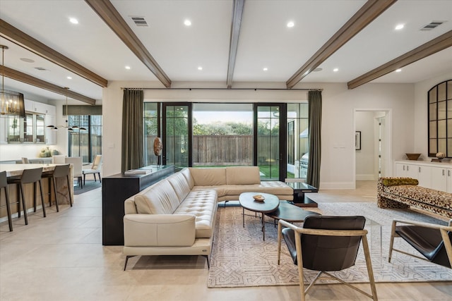 living area featuring beam ceiling, visible vents, and recessed lighting