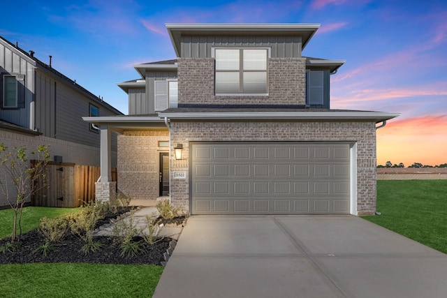 view of front facade with fence, board and batten siding, concrete driveway, a garage, and brick siding