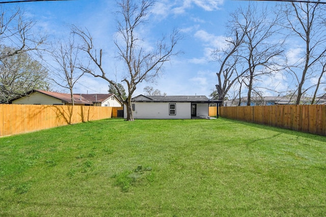 view of yard featuring a fenced backyard