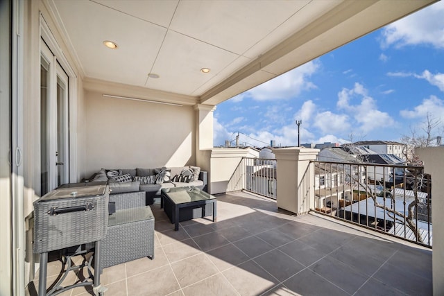 view of patio featuring an outdoor living space and a balcony