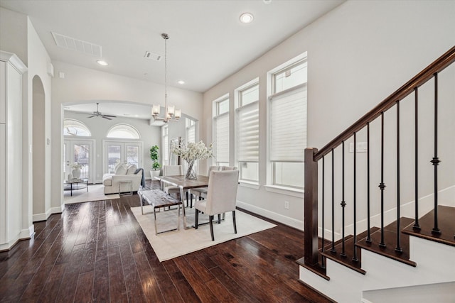 dining space featuring visible vents, stairs, recessed lighting, arched walkways, and wood-type flooring