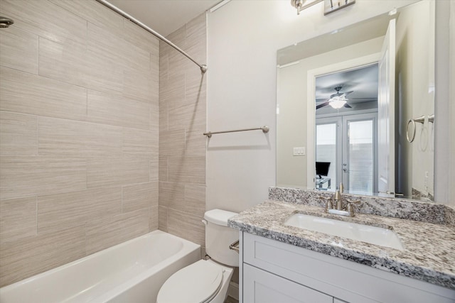 bathroom with vanity, toilet, shower / tub combination, and french doors