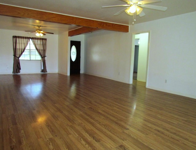 spare room featuring ceiling fan, beamed ceiling, and wood finished floors