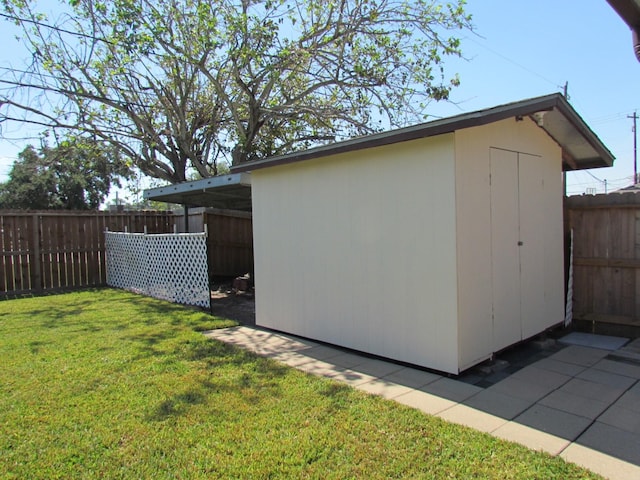 view of shed featuring a fenced backyard