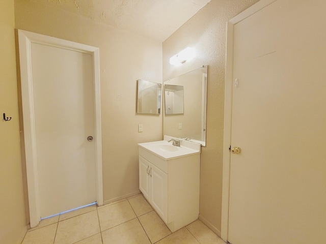 bathroom featuring tile patterned floors and vanity