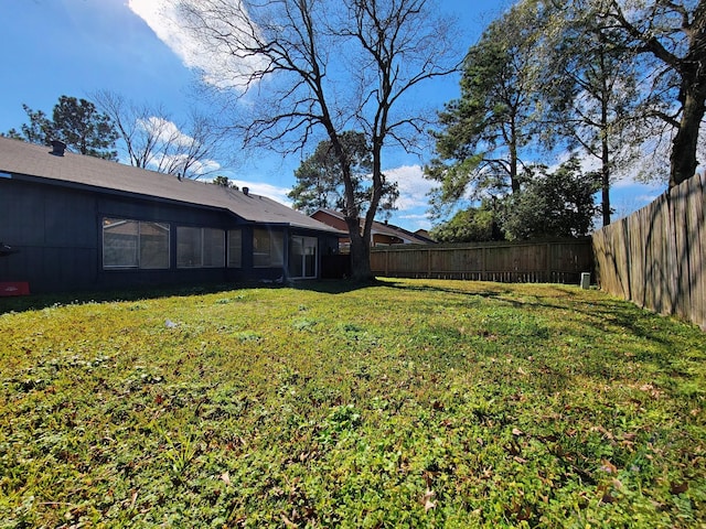 view of yard with a fenced backyard