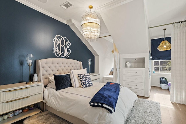 bedroom with a chandelier, visible vents, crown molding, and wood finished floors