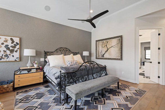 bedroom featuring baseboards, a ceiling fan, wood finished floors, and crown molding