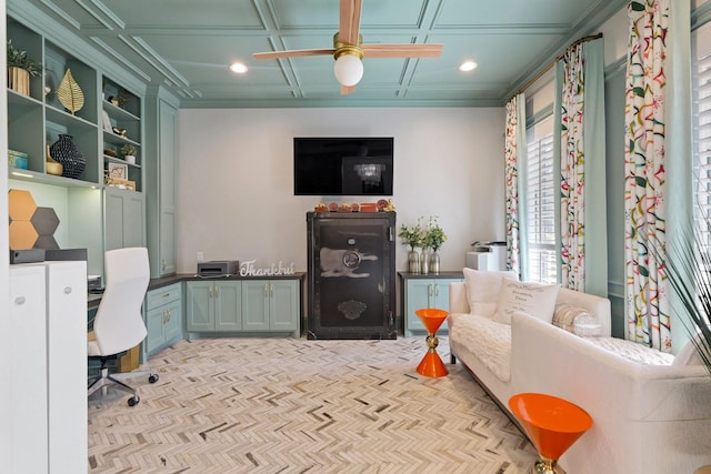 office area with recessed lighting, a ceiling fan, built in desk, and coffered ceiling