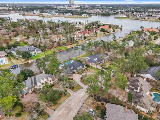 bird's eye view featuring a water view and a residential view