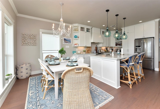 kitchen with open shelves, custom exhaust hood, stainless steel fridge with ice dispenser, a kitchen island with sink, and light countertops