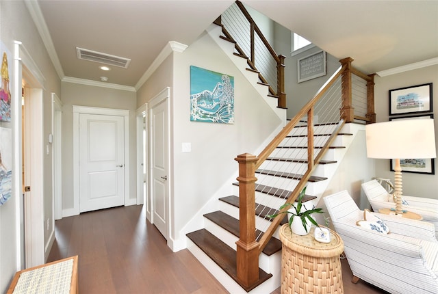 staircase featuring visible vents, ornamental molding, wood finished floors, recessed lighting, and baseboards