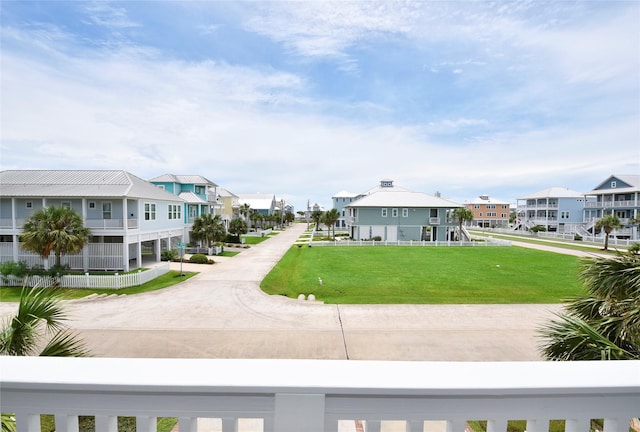 view of community featuring a residential view and a lawn