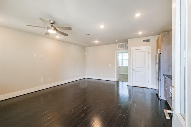 unfurnished room featuring recessed lighting, visible vents, and dark wood-style flooring