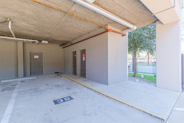 garage with fence