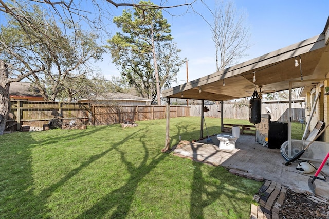 view of yard featuring a patio and a fenced backyard