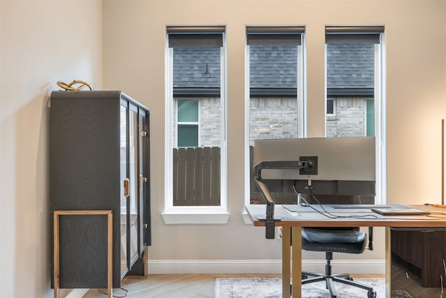 office area featuring wood finished floors and baseboards