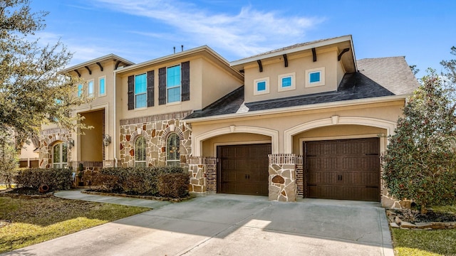 view of front of house featuring driveway, a shingled roof, stucco siding, a garage, and stone siding