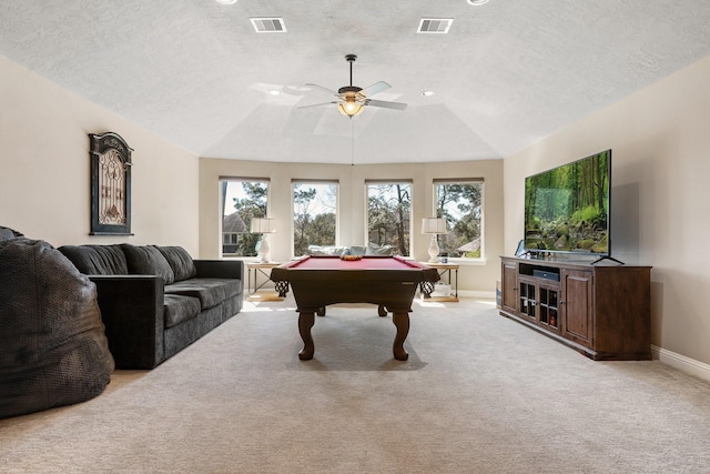 recreation room with plenty of natural light, light colored carpet, and visible vents