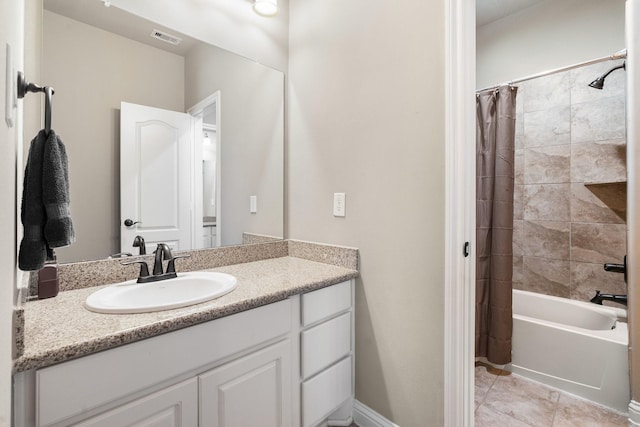 full bathroom with tile patterned floors, visible vents, vanity, and shower / bathtub combination with curtain