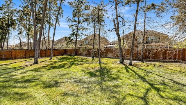 view of yard featuring a fenced backyard