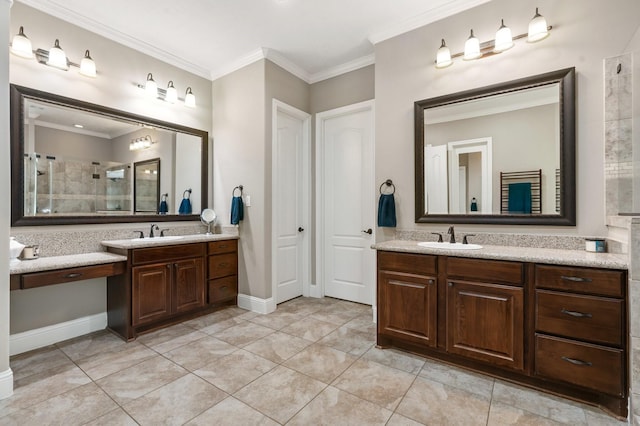 bathroom with ornamental molding, two vanities, and a sink