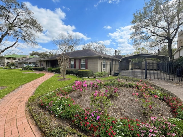 view of front of house with a detached carport, fence, a chimney, a front lawn, and brick siding