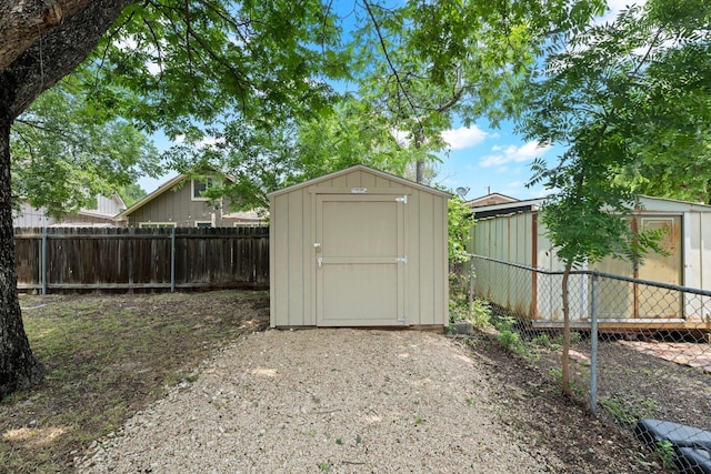 view of shed with a fenced backyard