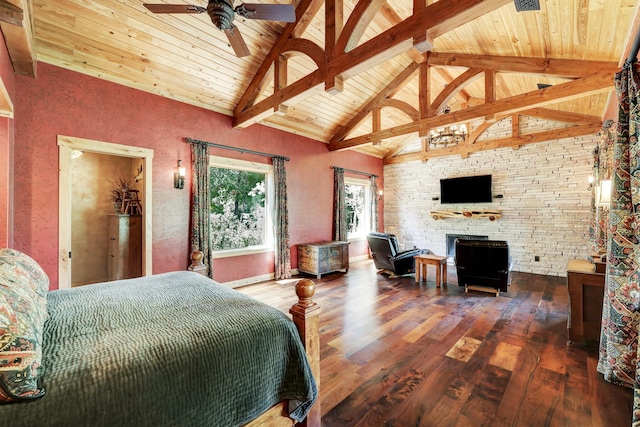 bedroom featuring wooden ceiling, beamed ceiling, wood finished floors, and high vaulted ceiling