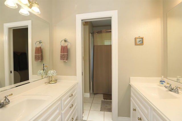 bathroom featuring vanity, tile patterned floors, and an inviting chandelier