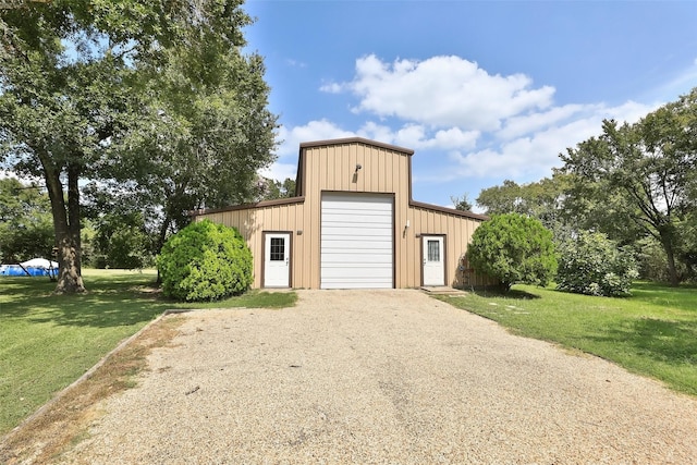 view of outbuilding featuring gravel driveway and an outdoor structure